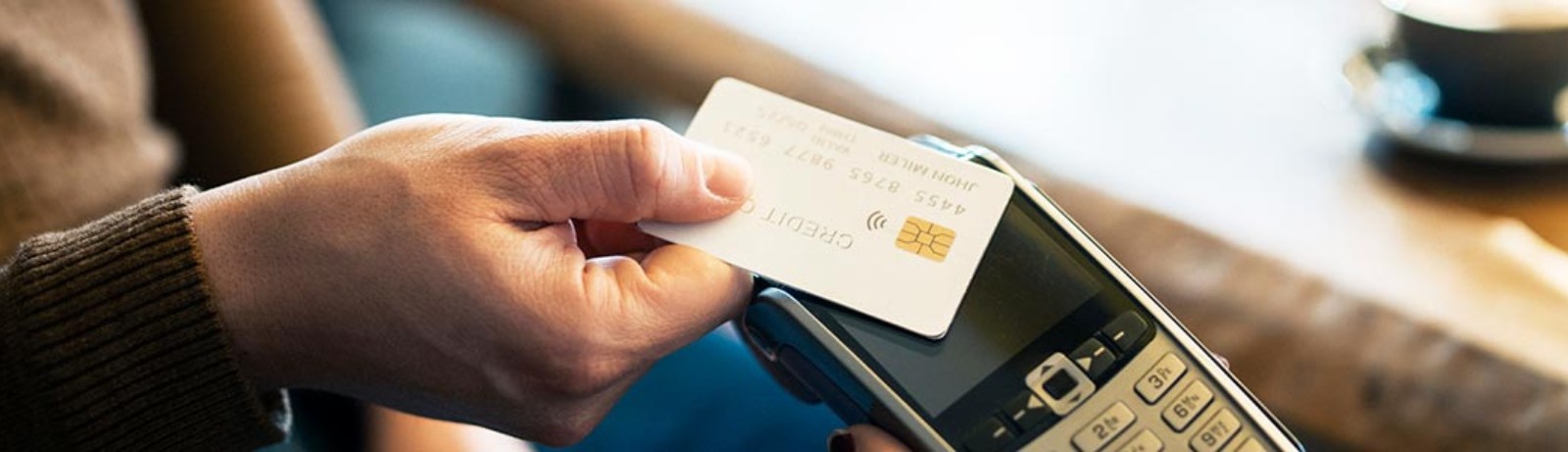 a person paying with a debit/credit card