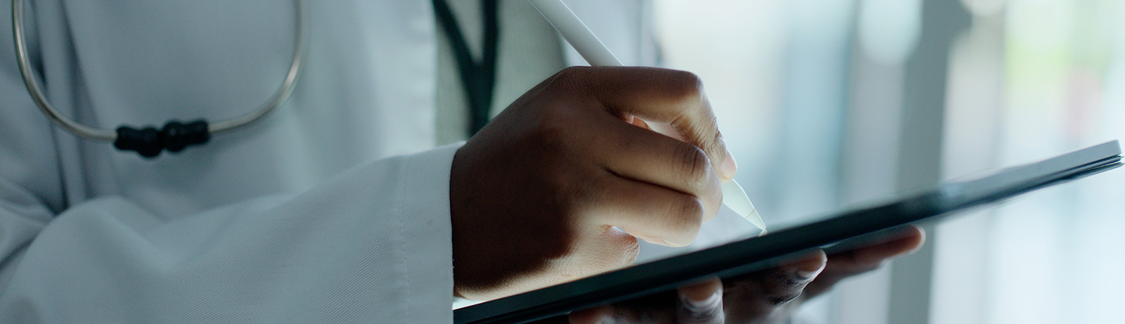 Close up of doctor taking notes