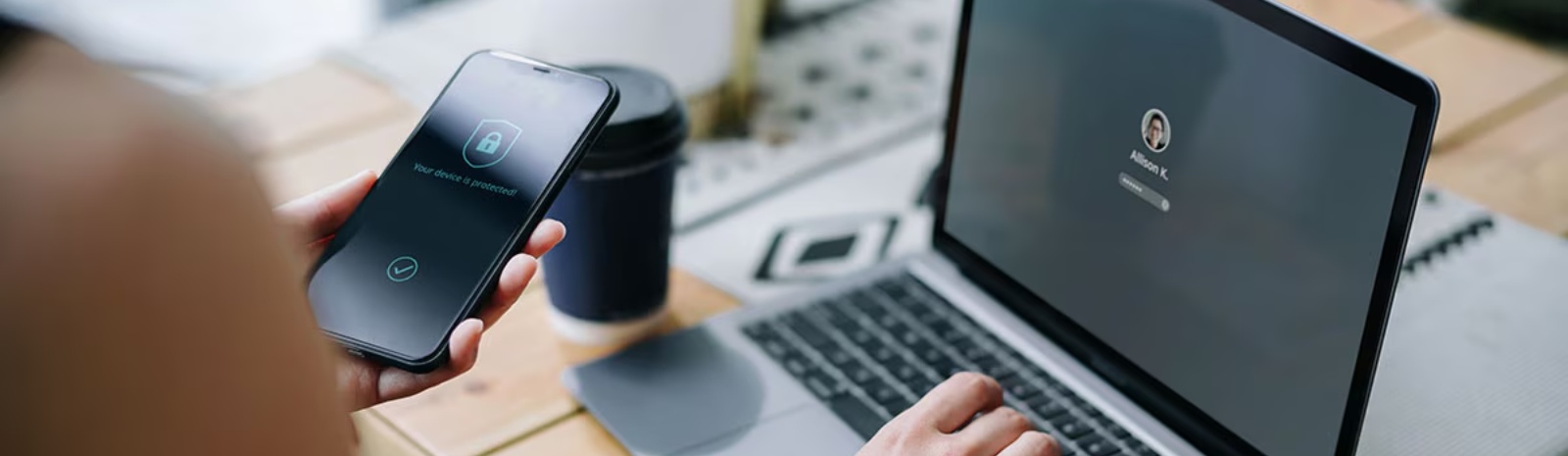 Smartphone and laptop screens with a security icon